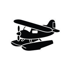 Silhouette of a classic seaplane with pontoons floating on water ready for takeoff or landing