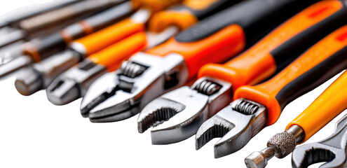 Fototapeta premium Close-up of Silver and Orange Adjustable Wrenches and Pliers on Black Background