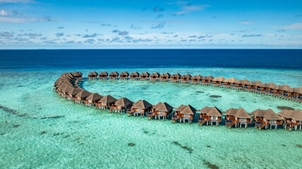 Amazing Maldives resort water villas aerial landscape sunny tropical island blue sea stunning...
