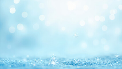 Fototapeta premium Winter scene with snowflakes bokeh effect and light blue background image