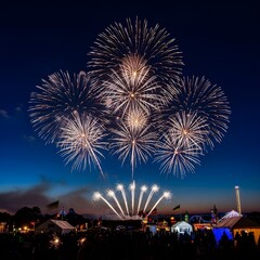 Spectacular fireworks display illuminate the night sky over a festive outdoor gathering, evoking celebration