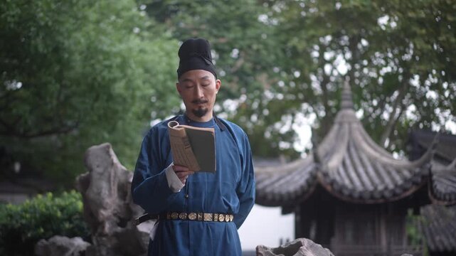 A man in traditional Chinese attire holding a book stands in a classical Chinese garden courtyard