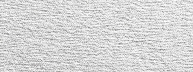 Close-up view of a textured, white fabric or material with visible woven threads running diagonally across the surface.  The weave creates a subtle, raised pattern