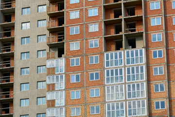 Glazing.New multistorey house.Construction of buildings