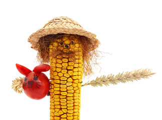 Funny corn cob man with tomato bunny isolated on white background.