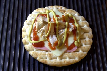 Grilled Pita Sandwich with Chicken, Ham, and Cheese