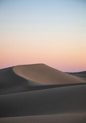Desert Sand Dunes Under Pastel Sunset Sky