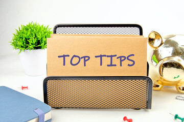 Business and Top tips concept, copy space. Top tips symbol on a postal envelope in a stand on a...