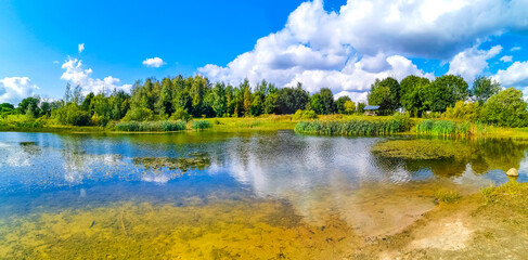 Park Civali Tivali pond lake nature and forest panorama Minsk Belarus.