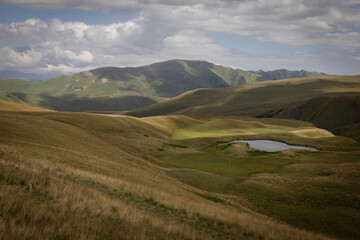 Beautiful landscape with mountains and cloudy sky.