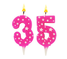 Burning pink with white stars birthday cake candles isolated on white background. Number 35.
