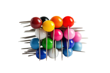 Colorful round-headed sewing pins arranged in a stack on a neutral background showcasing their vibrant hues and sharp points ideal for crafting and sewing projects