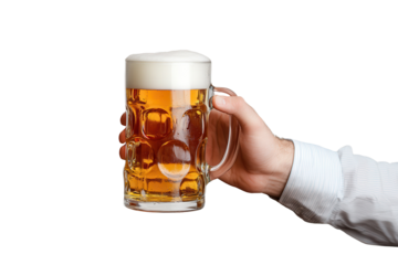 Man holds a beer glass in a casual setting during a social gathering with friends, enjoying the moment outdoors