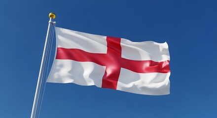 The flag of england, also known as st georges cross, waving proudly against a clear blue sky on a sunny day
