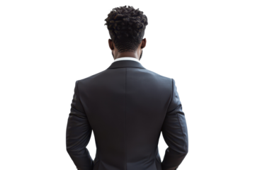 Business man in a suit standing confidently against a white background with a focused posture, suggesting professionalism and ambition