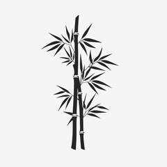 Naklejka premium Striking black bamboo stems with leaves against a bright background silhouette