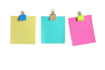 Colorful sticky notes clipped on a board with vibrant colors in a workspace setting perfect for reminders and organization