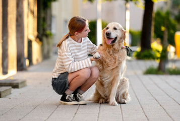 Golden Retriever Giving Paw To Owner While A Girl On The Street Watches