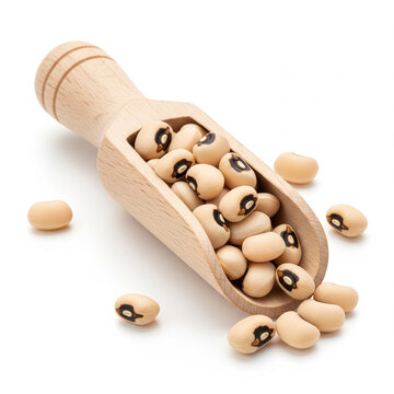 Wooden scoop filled with raw black eyed peas lobia isolated on white background