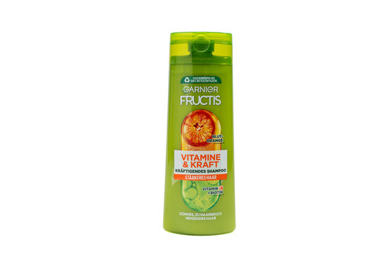 Germany Berlin August 29, 2025. Garnier Fructis Vitamins and Strength Shampoo with Blood Orange, isolated on a white background. Green bottle design.