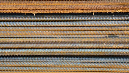 rusty threaded rebar or iron or steel, construction materials, texture and background
