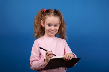 Smiling Girl Writing Notebook