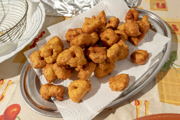 Fried potato and sweet potato fritters in an aluminum tray. Typical Mallorcan food.