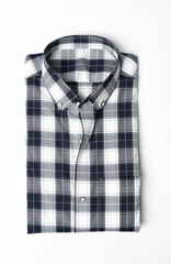 Folded plaid button down shirt isolated
