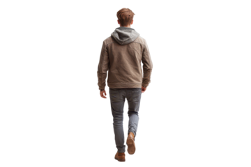 Young man casually dressed walks alone in a minimalist setting during daylight demonstrating a relaxed demeanor through his attire and posture
