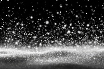 Obraz premium White snow particles gently falling and creating a delicate layer on a dark background during a serene winter evening