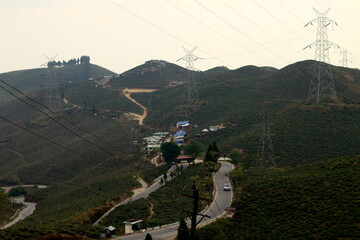 Mirik, India-December 24, 2017: Serpentine roads carressing the hill in Darjeeling, India. On the way to Mirik, West Bengal India. Scenic beauty of tingling view point near Mirik.  