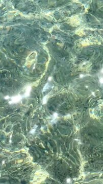 Top view of sea little waves pattern and crystal clear water. Armenia, Sevan. High quality photo