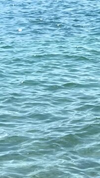 Top view of sea little waves pattern and crystal clear water. Armenia, Sevan. High quality photo