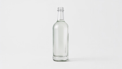 Clean Empty Clear Glass Bottle Standing Upright on a White Background