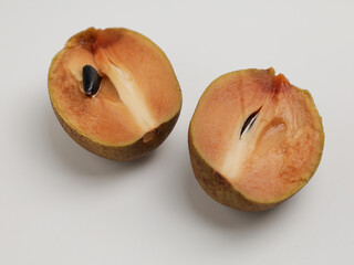 Sawo or sapodilla fruit on white background
