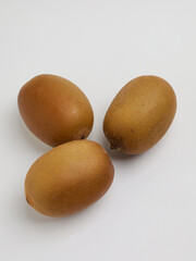 Golden kiwi on white background
