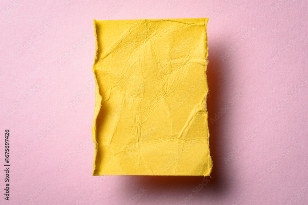 Aufkleber one single yellow torn ripped wrinkled crumpled blank paper note with drop shadow, folded edge and c