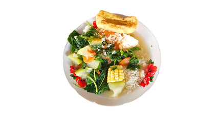 Vegetable soup rice with fried tofu served in a plate, complete with fresh broth and healthy vegetables. This delicious dish is perfect for a nutritious and tasty lunch