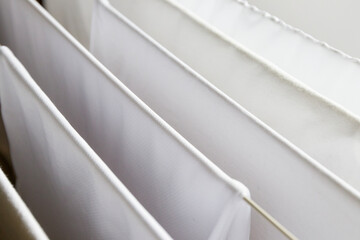 Washed white clothes on a hanger.