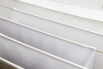 Washed white clothes on a hanger.