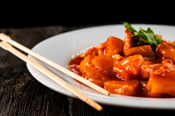 Chicken with pineapple in sweet and sour sauce. Asian food. Chinese cuisine