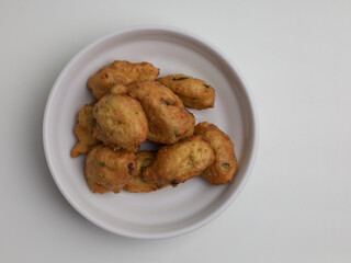 Tofu fritters, piled on white plate