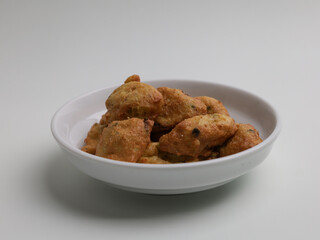 Tofu fritters, piled on white plate
