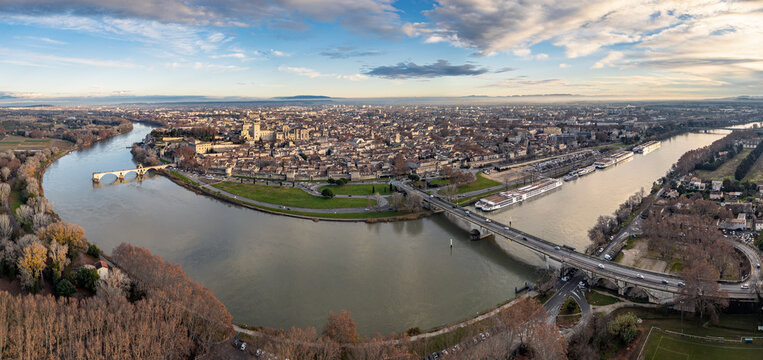 Panoramic sunset view of Avignon old town with Palais des Papes and Rhone River, France &ndash; historic cityscape, medieval architecture, cultural heritage and travel destination