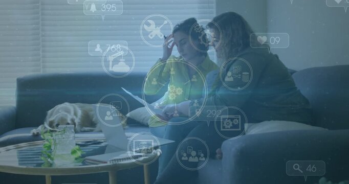 This video shows a lesbian couple spending time relaxing at home with their dog