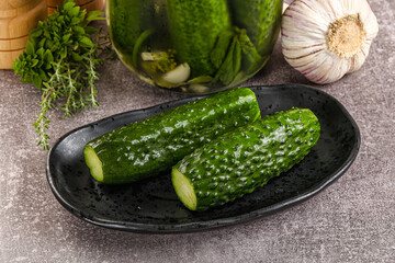Homemade lighty salted cucumbers with herbs