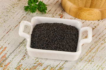Black dry Nigella seeds in the bowl