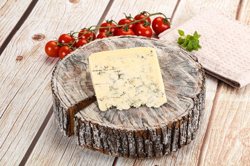 Blue cheese with mold over board