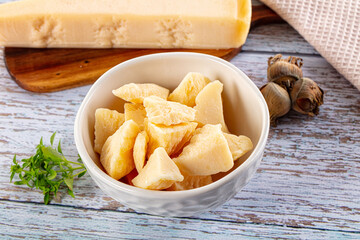 Parmesan cheese pieces in the bowl