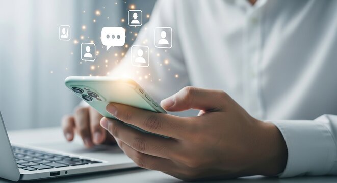 Person using smartphone with social media and communication icons floating above